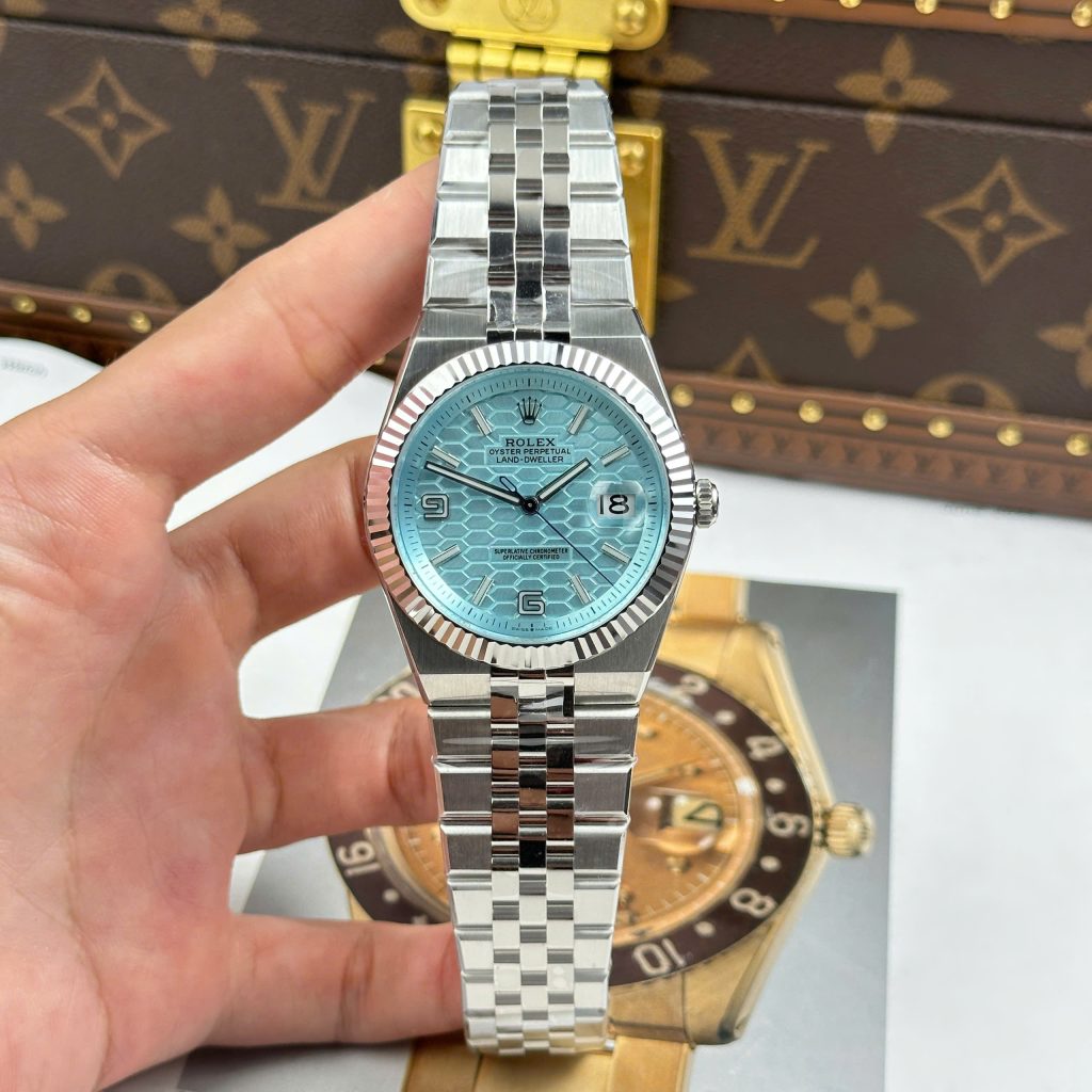 Đồng Hồ Rolex Land Dweller 127336 Chế Tác Mặt Xanh Băng Hoạ Tiết Tổ Ong 40mm